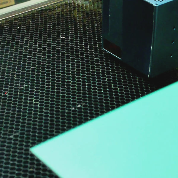 Colorful 3D puzzle-style flower bouquet in a polygonal wooden vase, made from layered laser-cut plywood.